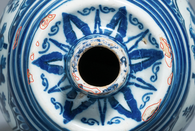 A Dutch Delft blue and white barrel-shaped gin flask with chinoiserie design, dated 1711